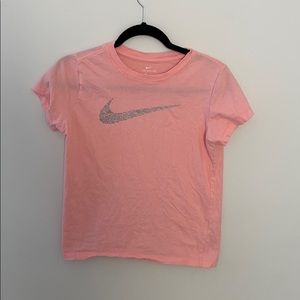 Pink Nike shirt.